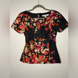 L. K. Bennett Black and Floral peplum style‎ blouse. Size 2